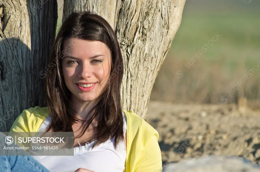 Beautiful girl looking at camera in countryside