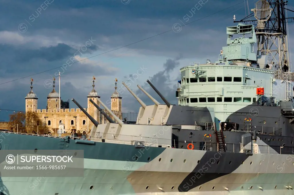 HMS Belfast with the Tower of London, on the Thames, London