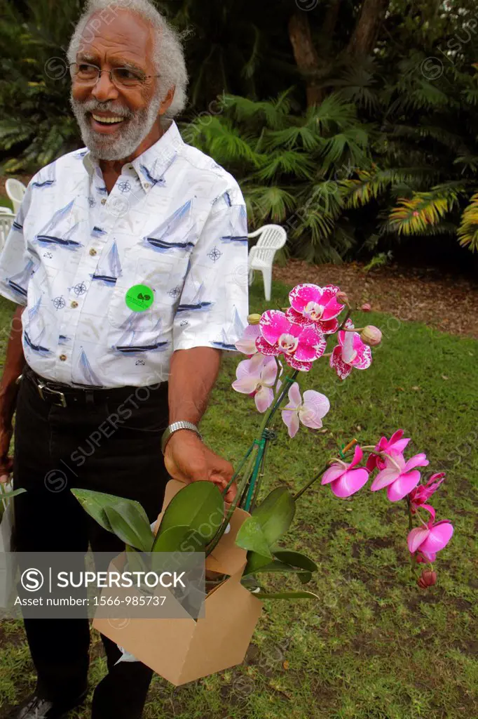 Florida, Miami, Coral Gables, Fairchild Tropical Gardens, Orchid Show, event, shopping, Black, man, flowers, purchase,
