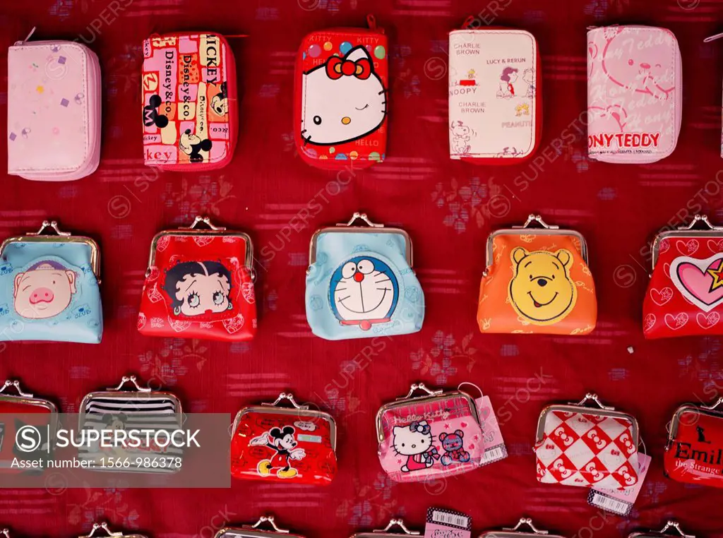 Small purses are sold on the streets on Shanghai to your teenagers - including motifs of Hello Kitty, Betty Boop, Winnie the Pooh, and others