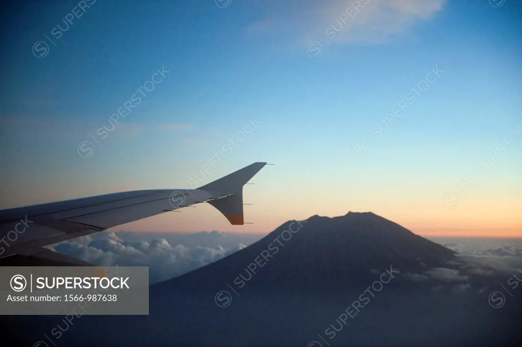 The peak of Mount Agung seen from a airplane window, rises 10, 308 feet above sea level