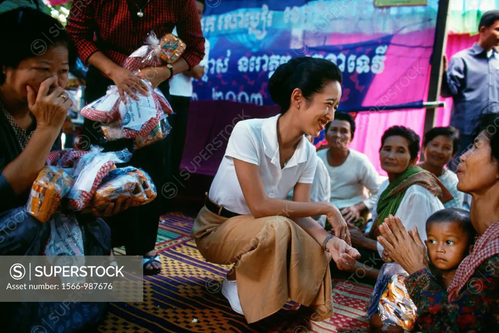 Princess Rattana Norodom of Cambodia handing out alms and interacting with the poor people in the villages of Cambodia