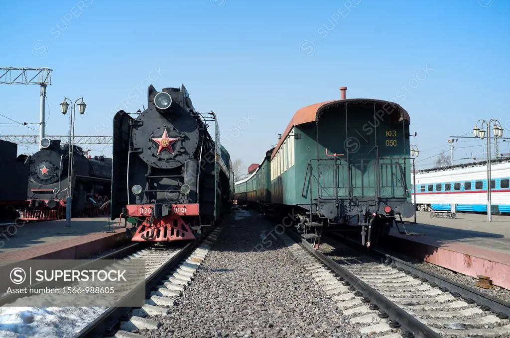 Russian steam locomotive and vintage car