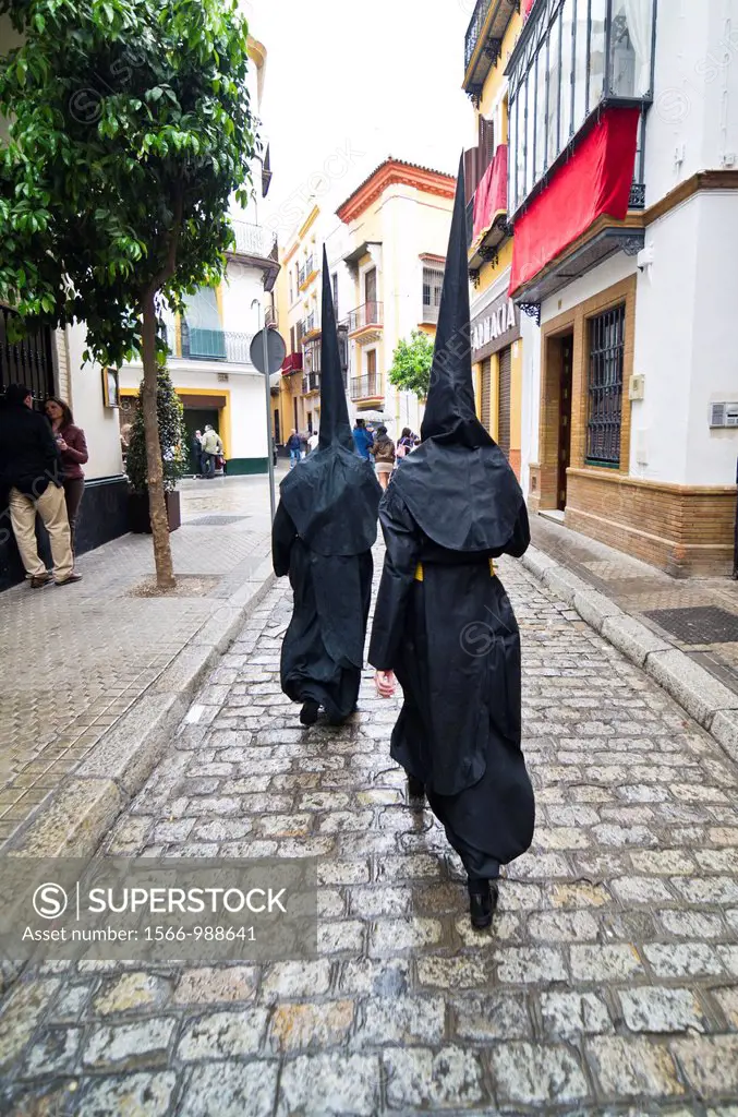 Penitents in Seville during Holy week celebration, Andalusia, Spain, Europe
