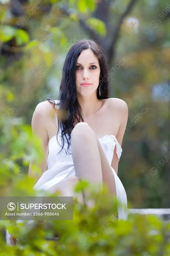 Attractive young woman, detached dress strap
