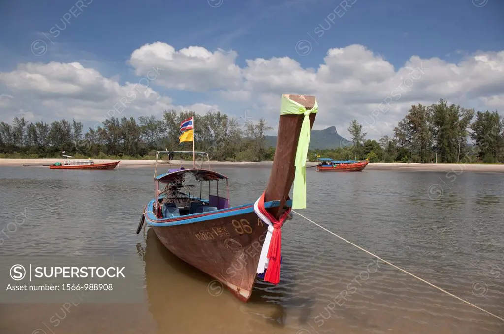 Long tailed boats and limestone karsts Krabi Thailand
