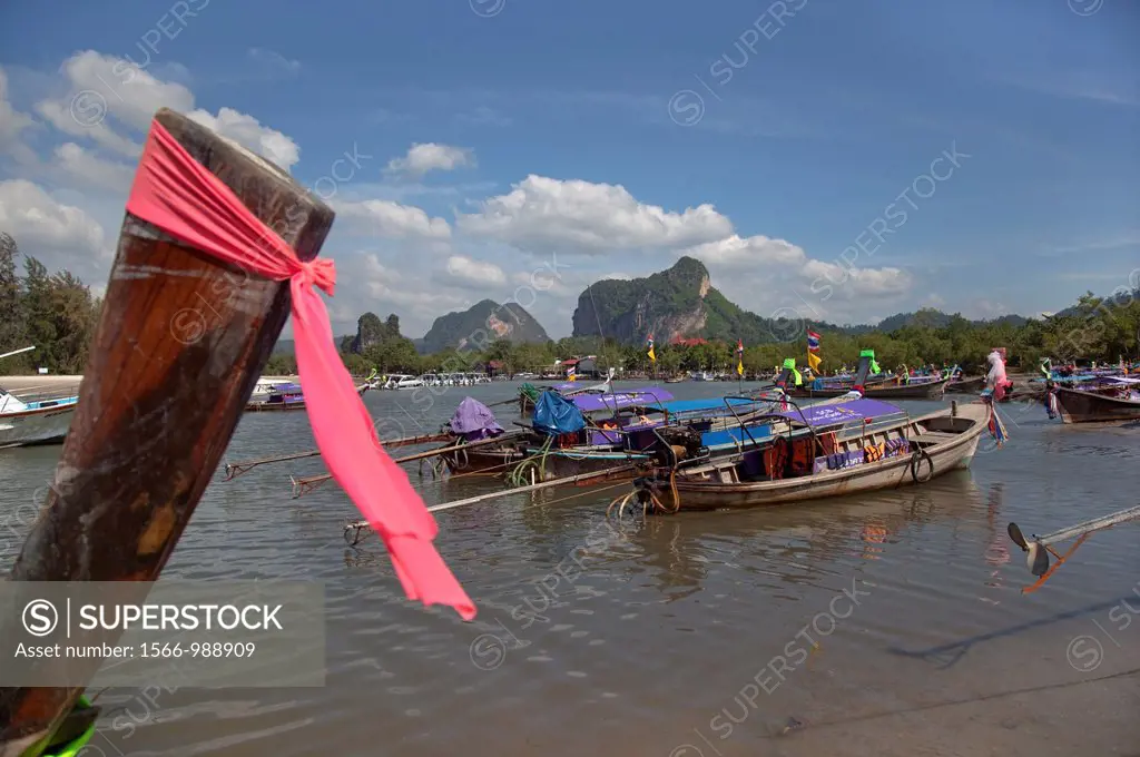 Long tailed boats and limestone karsts Krabi Thailand