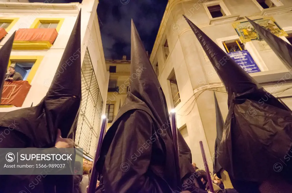 Penitents in Seville during Holy week celebration, Andalusia, Spain, Europe