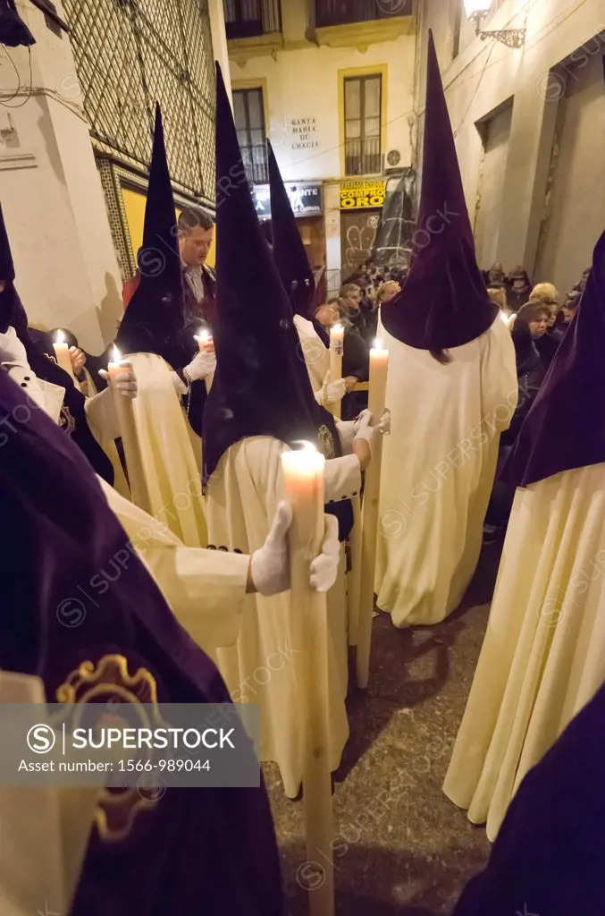 Penitents of Macarena brotherhood in Seville during Holy week celebration, Andalusia, Spain, Europe