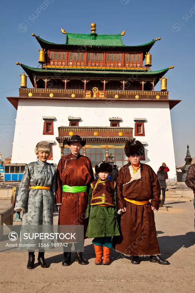 Family in traditional clothing pose for portrait, Ganden Buddhist monastery, Ulan Baatar, Mongolia