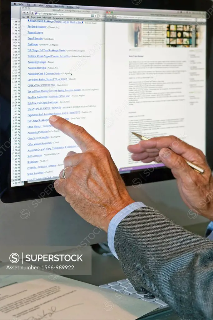 Man searches job listings online in Los Angeles, CA