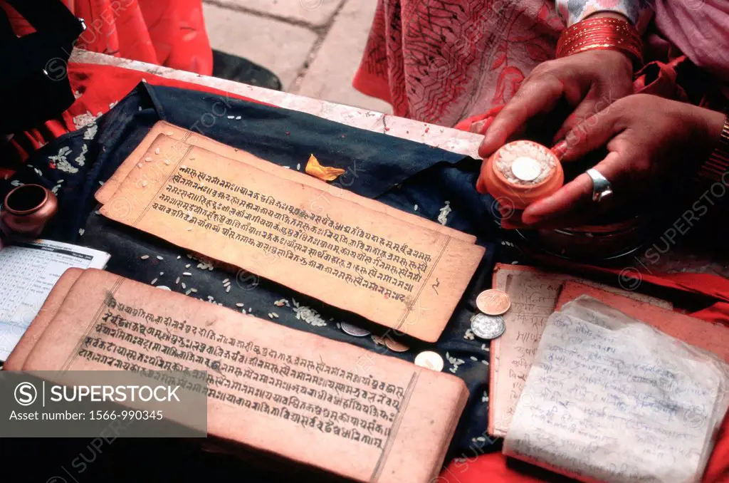 Hindu holy book at Harati temple, a local shrine popular among Newari. Swayambhunath, Kathmandu, Nepal. Newari are the original inhabitants of the Kat...