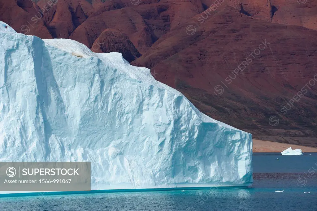 Iceberg with red Mountain, Røde Fjord, Scoresbysund, Greenland