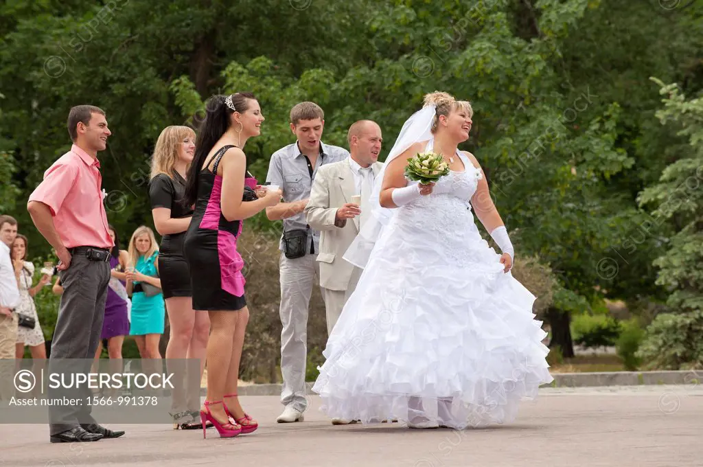 Wedding celebration near the Monument to the Founders of Kiev, Kiev, Ukraine, Europe