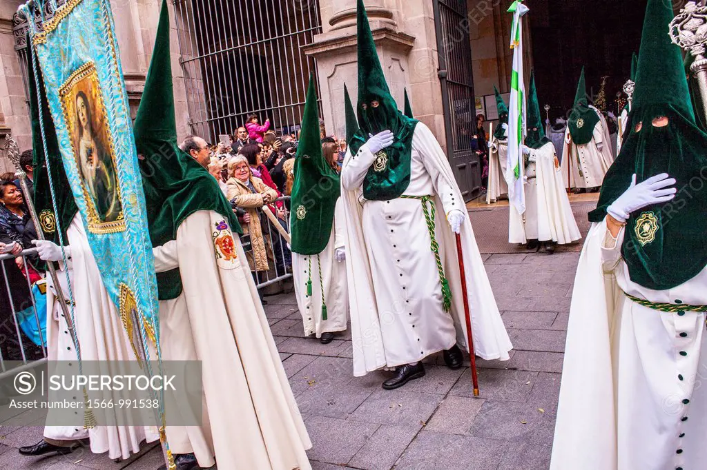 Hooded penitents in procession, sisterhood of Jesus del Gran Poder y virgen de la Macarena, Good Friday, Easter week, Plaza de San Agustin, Barcelona,...