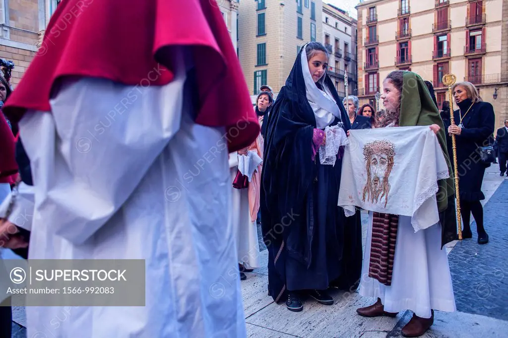 Penitents in procession, sisterhood of Virgen de las Angustias,Good Friday, Easter week,plaza Sant Jaume,Barcelona, Catalonia, Spain