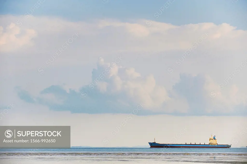 A freighter sits off the coast of the Malaysian coast