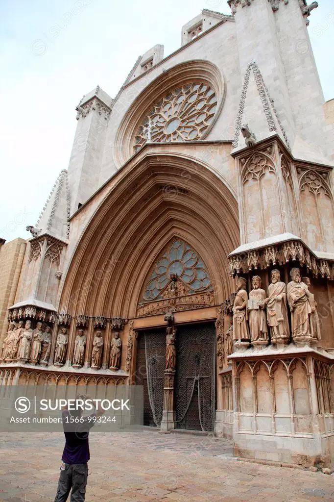 Tourist photographing the facade of the Cathedral of Tarragona, Spain, Europe