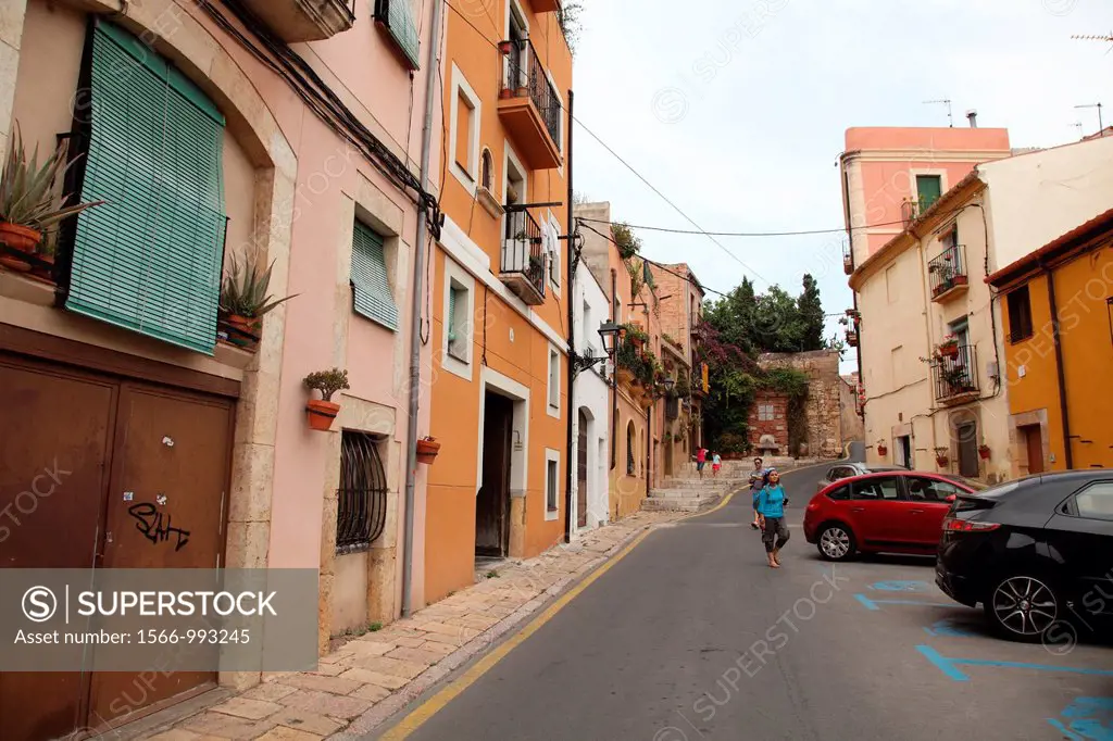 Tourists walking down a street in Tarragona, Spain, Europe