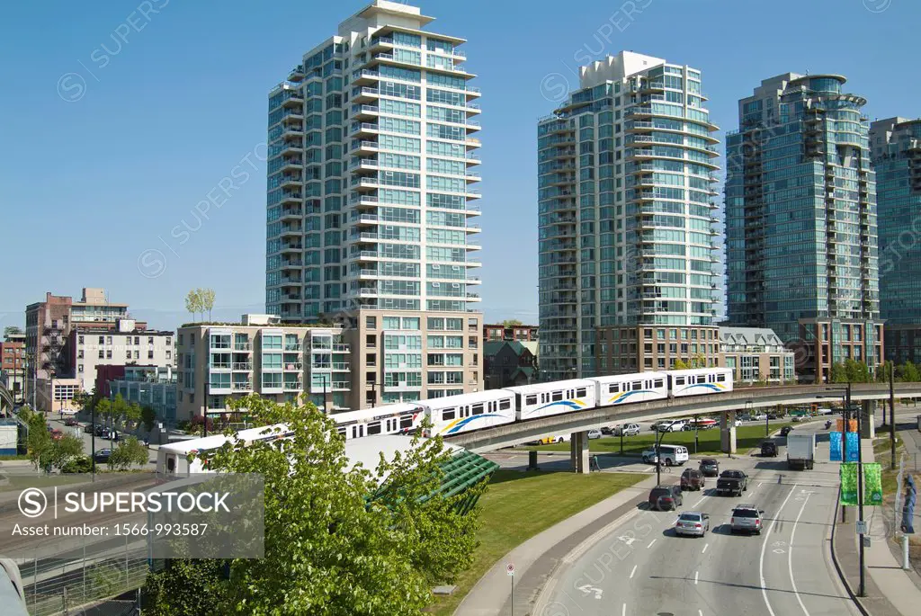 The Skytrain and tracks pass the apartment buldings at the east end of False Creek in Vancouver, BC, Canada