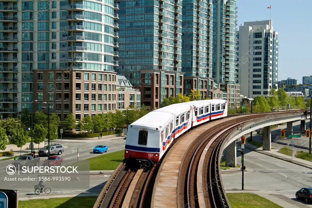 The Skytrain and tracks pass the apartment buldings at the east end of False Creek in Vancouver, BC, Canada