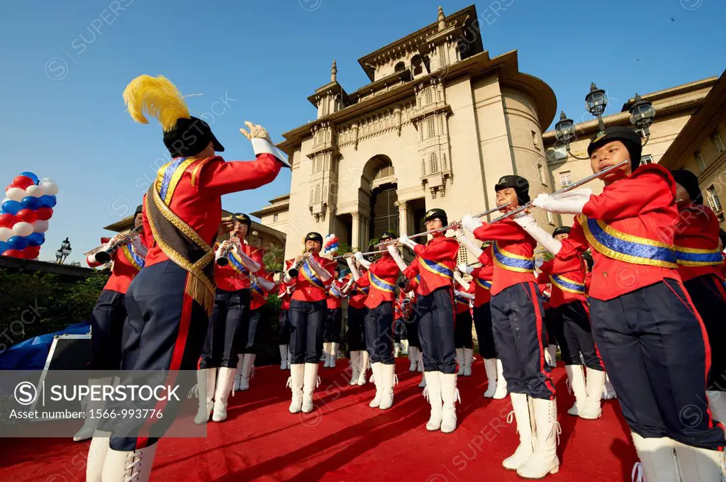 A traditional marching band playing outside the parliament building