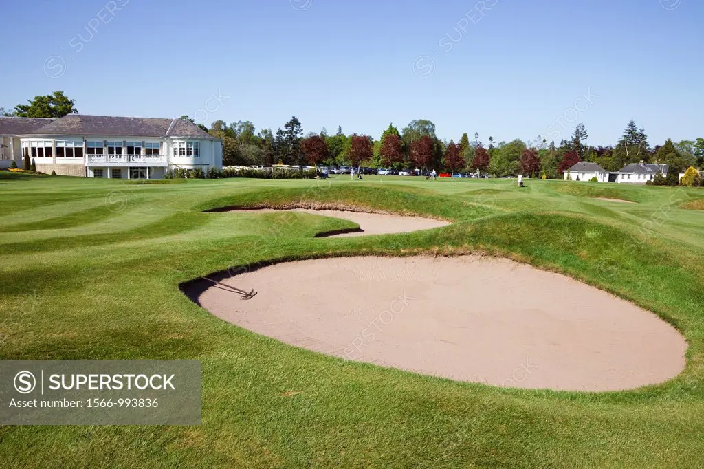 8th green and bunkers at the Kings Course, Gleneagles Golf Club with the Dormie House, Clubhouse and restaurant overlooking the fairway, Perth shire, ...