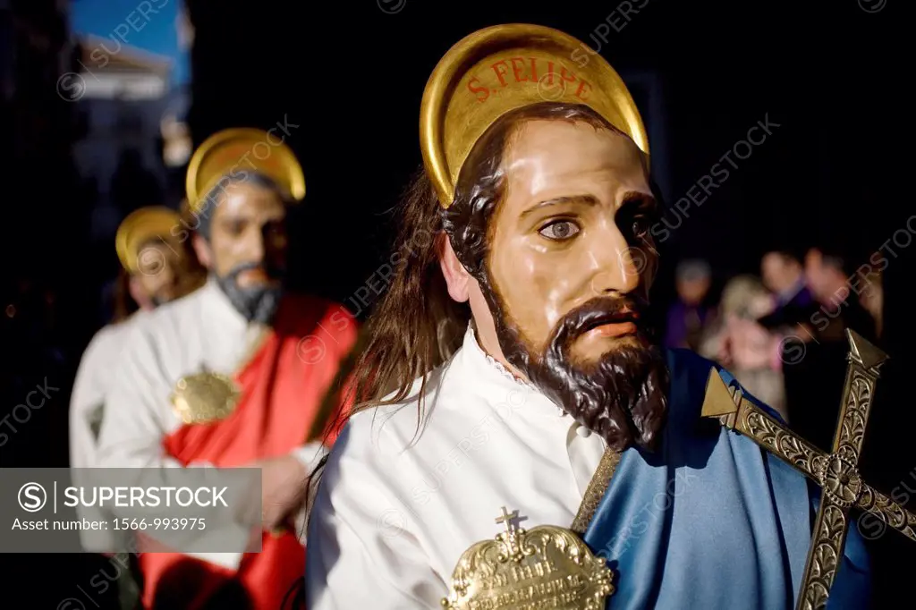 A masked man dressed as a biblical character holds a relic during an Easter Holy Week procession in Puente Genil, in the province of Cordoba, Andalusi...