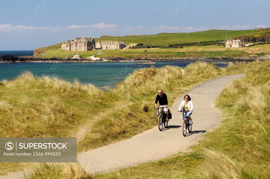 Cycling in sand dunes of Runkerry Strand, Portballintrae near Bushmills and Portrush, County Antrim, Northern Ireland  Summer