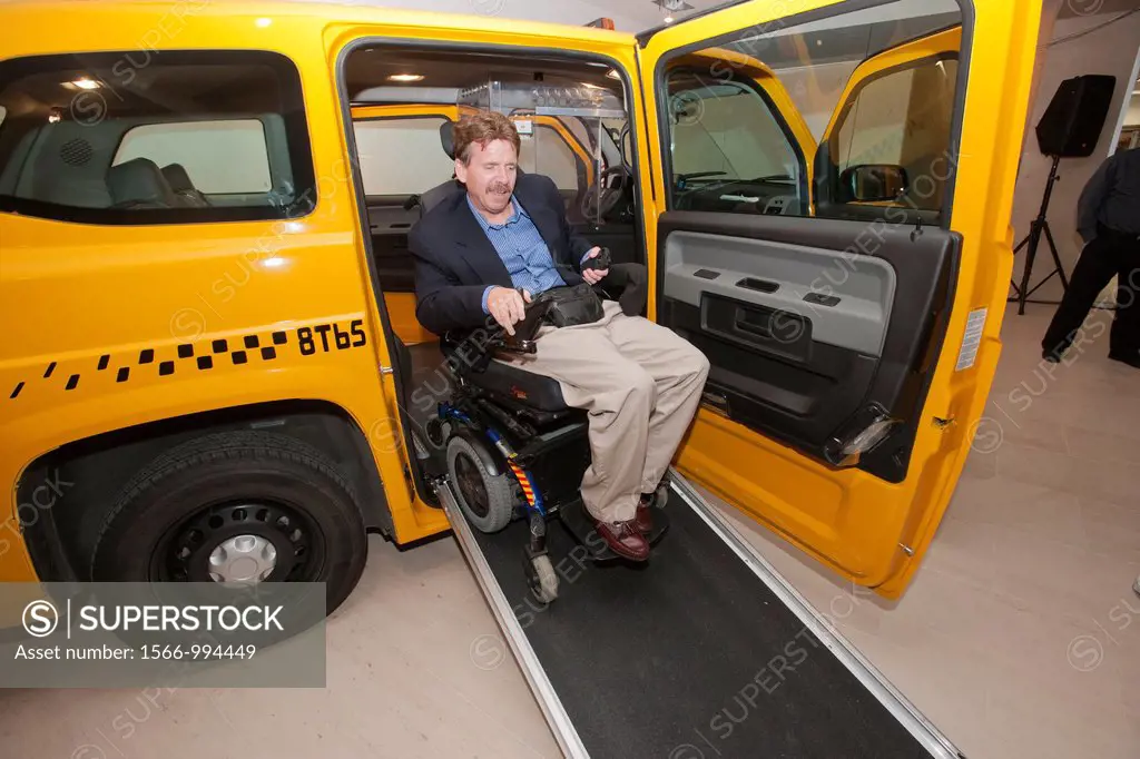 A disabled person tests the MV-1 handicapped accessible yellow cab at a news conference at the Manhattan Motorcars dealership in New York Manufactured...