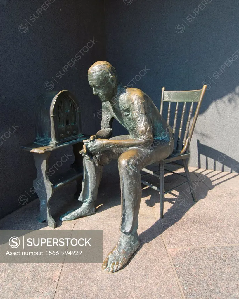Washington DC, USA, at the Franklin Delano Roosevelt Memorial, a sculpture of a citizen listening to a Fireside Chat on the radio.