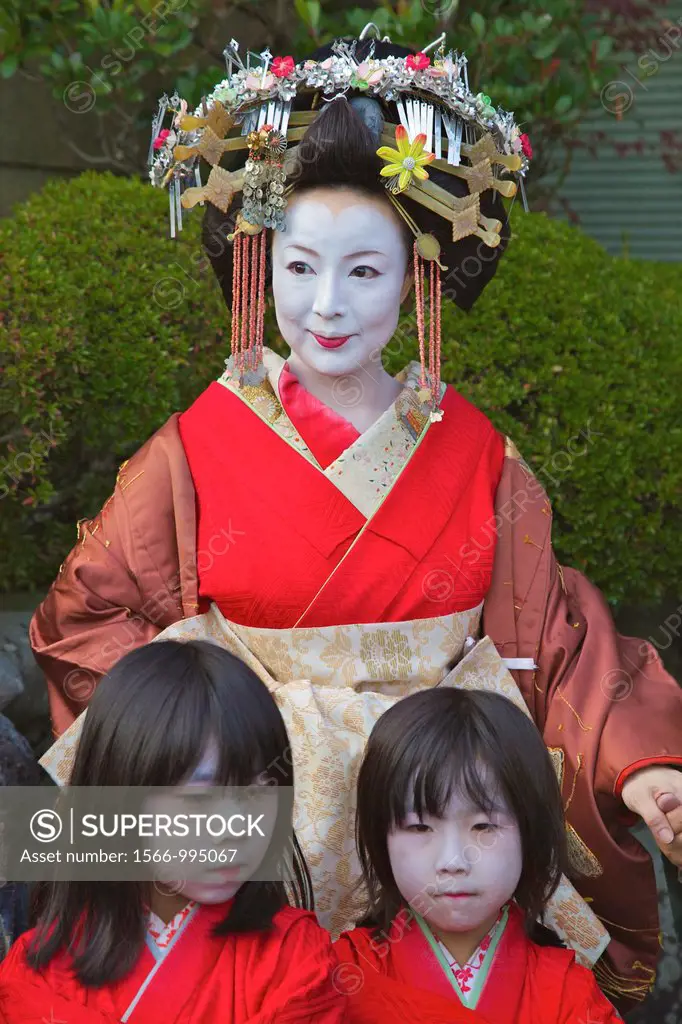 A participant in the Arashiyama Maple Leaf Festival dressed up as the ´Tayu´, the highest class prostitute in Shimabara, Kyoto with her attendants