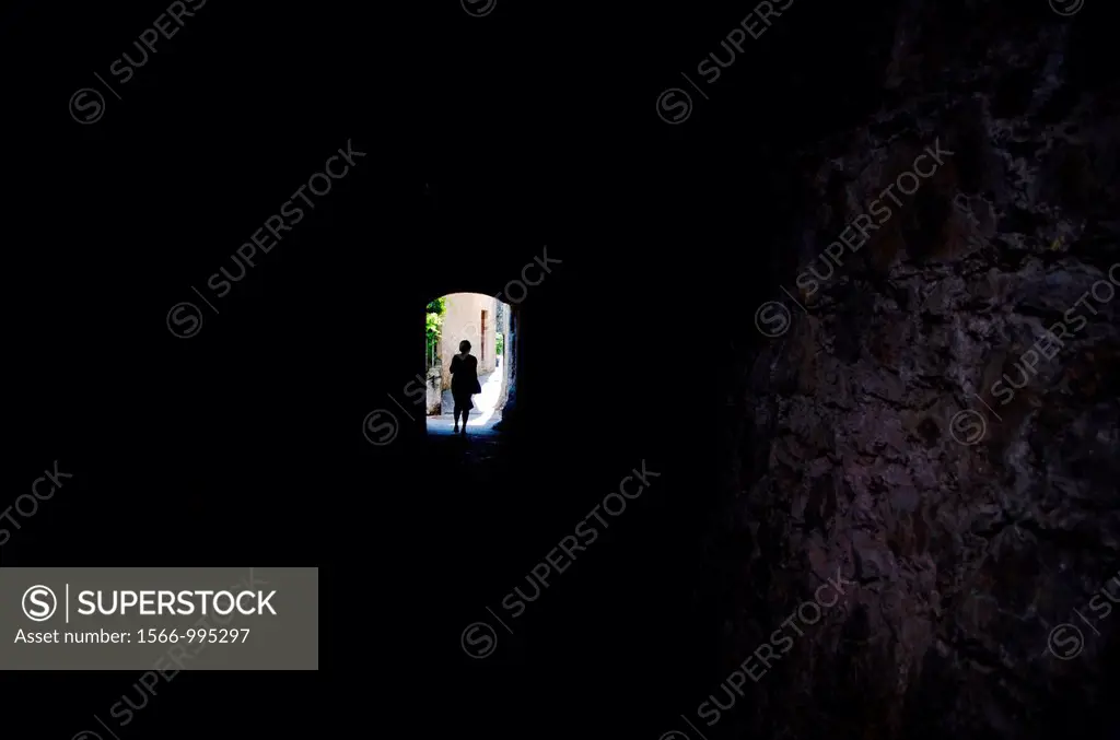 Woman walking in a dark alley in gandria