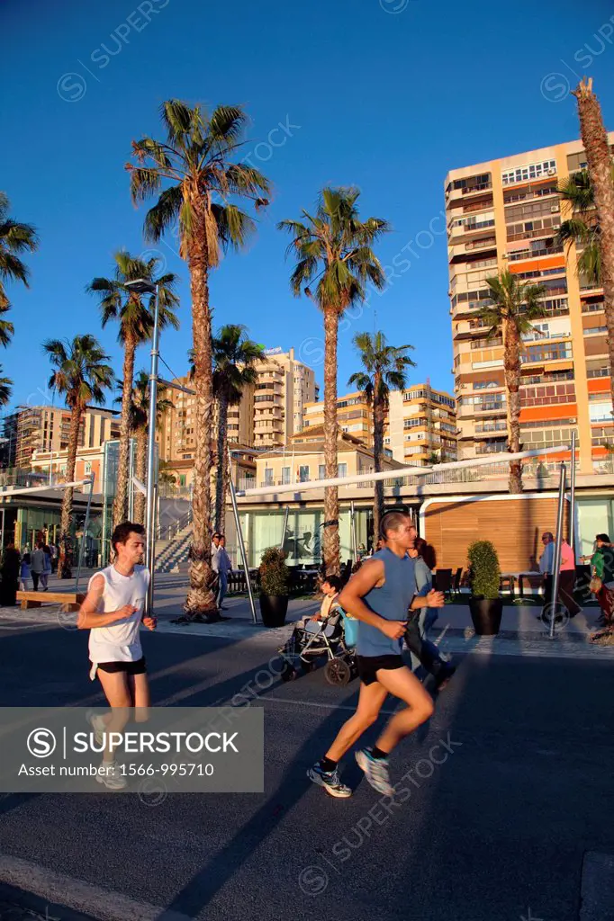 Young working out along the promenade of Malaga