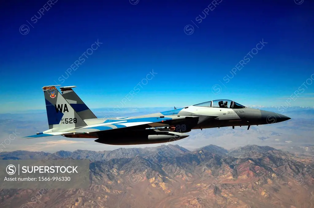 An F-15E Strike Eagle from the 65th Aggressor Squadron flies in support of and dogfights against members of the Air Force Weapons School over Nellis A...