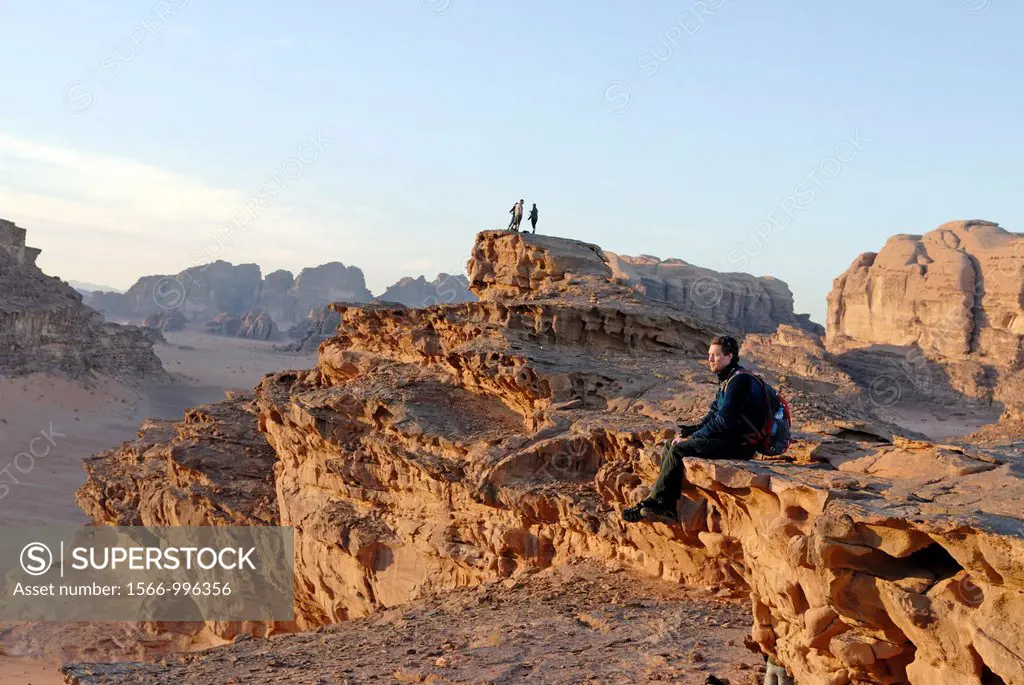man sitting in the Wadi Rum desert at dusk, , Jordan, Middle East, Asia