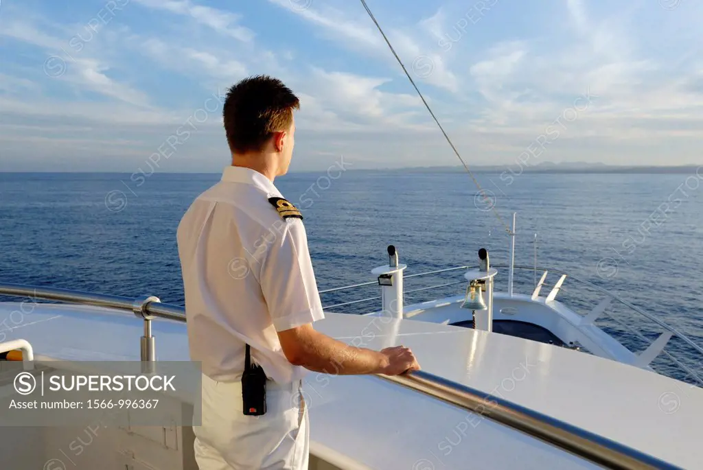 sailor standing at the prow of a cruise ship in Red Sea, Jordan, Middle East, Asia