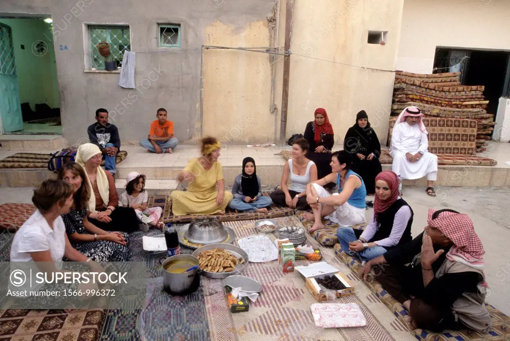 tourists taking part in the preparation of the dinner at villager´s house in the village of Um-Sayhoun where are living the most part of Bedoins worki...