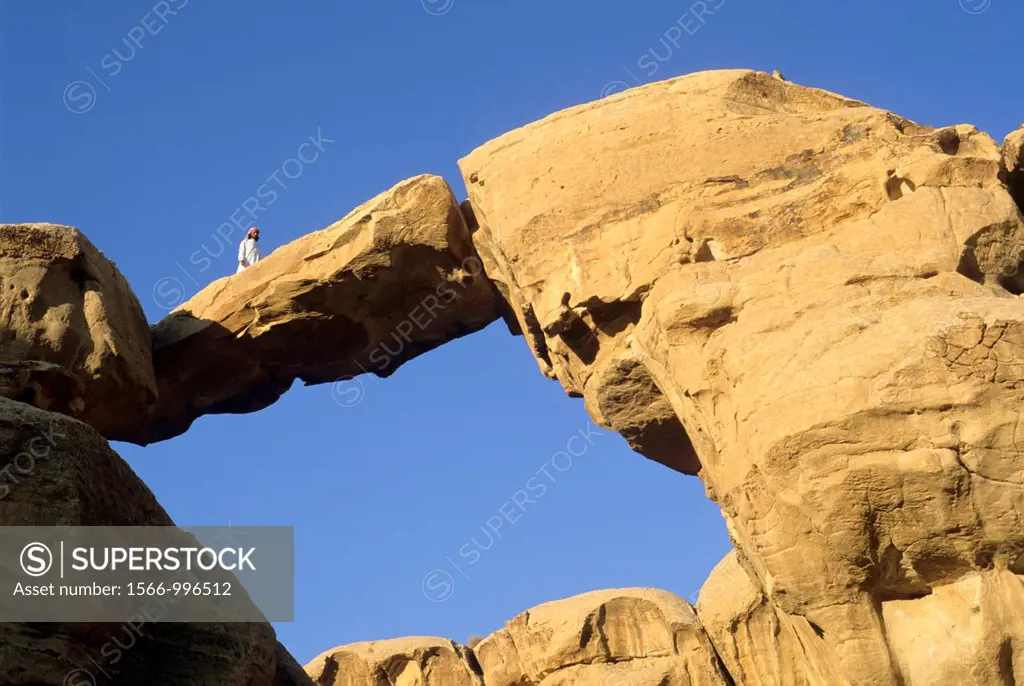 bedouin under the Um Frouth Rock Bridge, desert of Wadi Rum, Jordan, Middle East, Asia