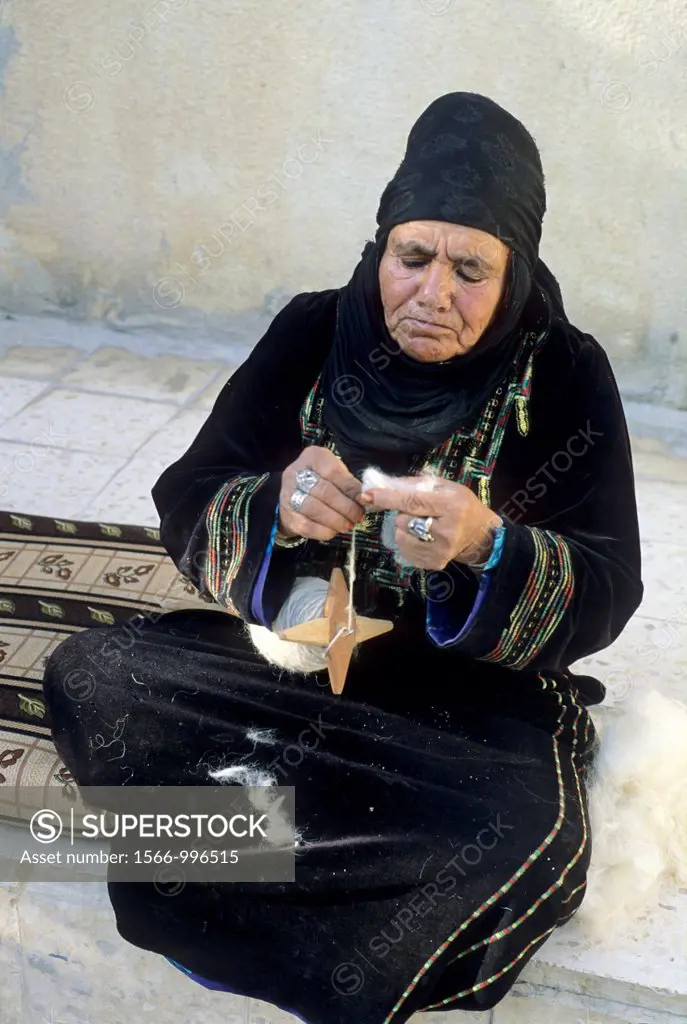 old Bedouin woman at home in the village of Um-Sayhoun where are living the most part of Bedoins working on the Petra site, Jordan, Middle East, Asia