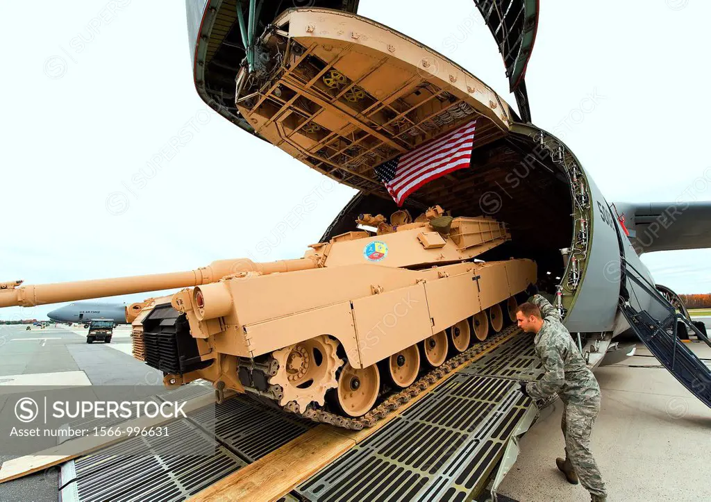 Airmen load a tank into a C-5M Super Galaxy Nov  15, 2011, at Dover Air Force Base, Del  The C-5M is the upgraded version of the C-5 Galaxy and has a ...