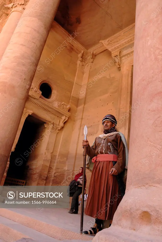 guard in costume of Al Khazneh or The Treasury, one of the most elaborate buildings of the ancient city of Petra, Jordan, Middle East, Asia