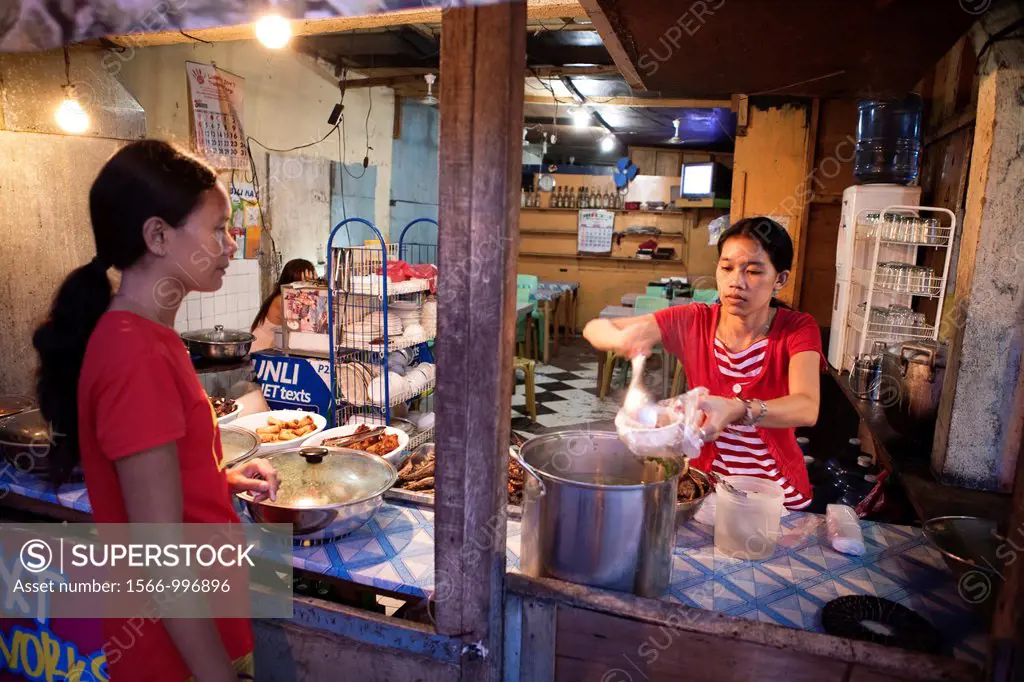 Filipino woman buying food at a roadside eatery  Lapu-Lapu City, Metro Cebu, Mactan Island, Visayas, Philippines