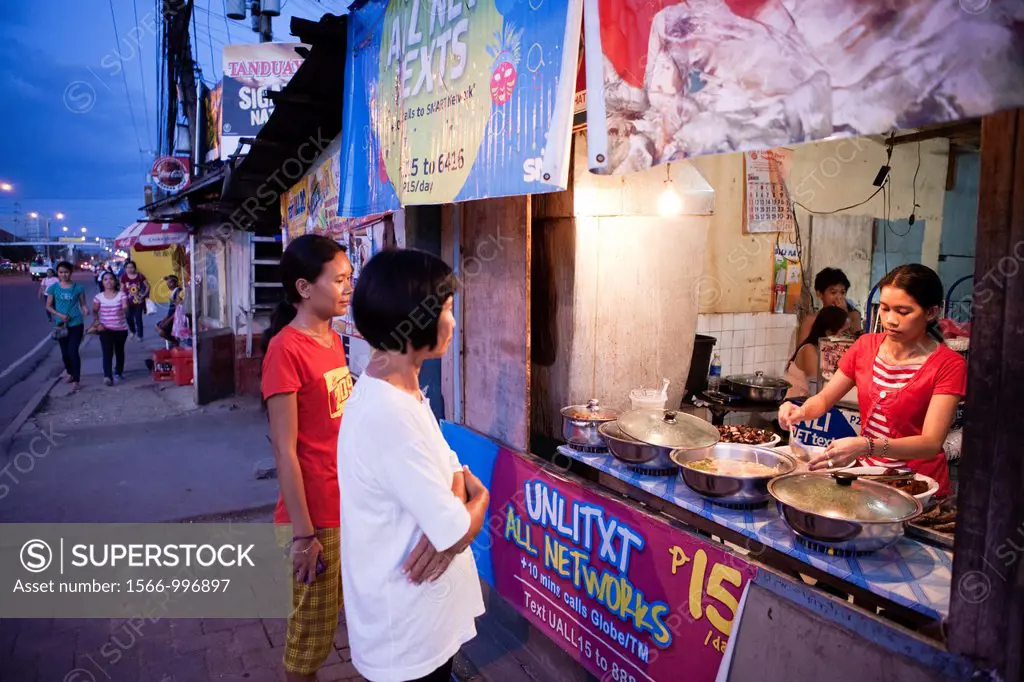 Filipino women buying food at a roadside eatery  Lapu-Lapu City, Metro Cebu, Mactan Island, Visayas, Philippines