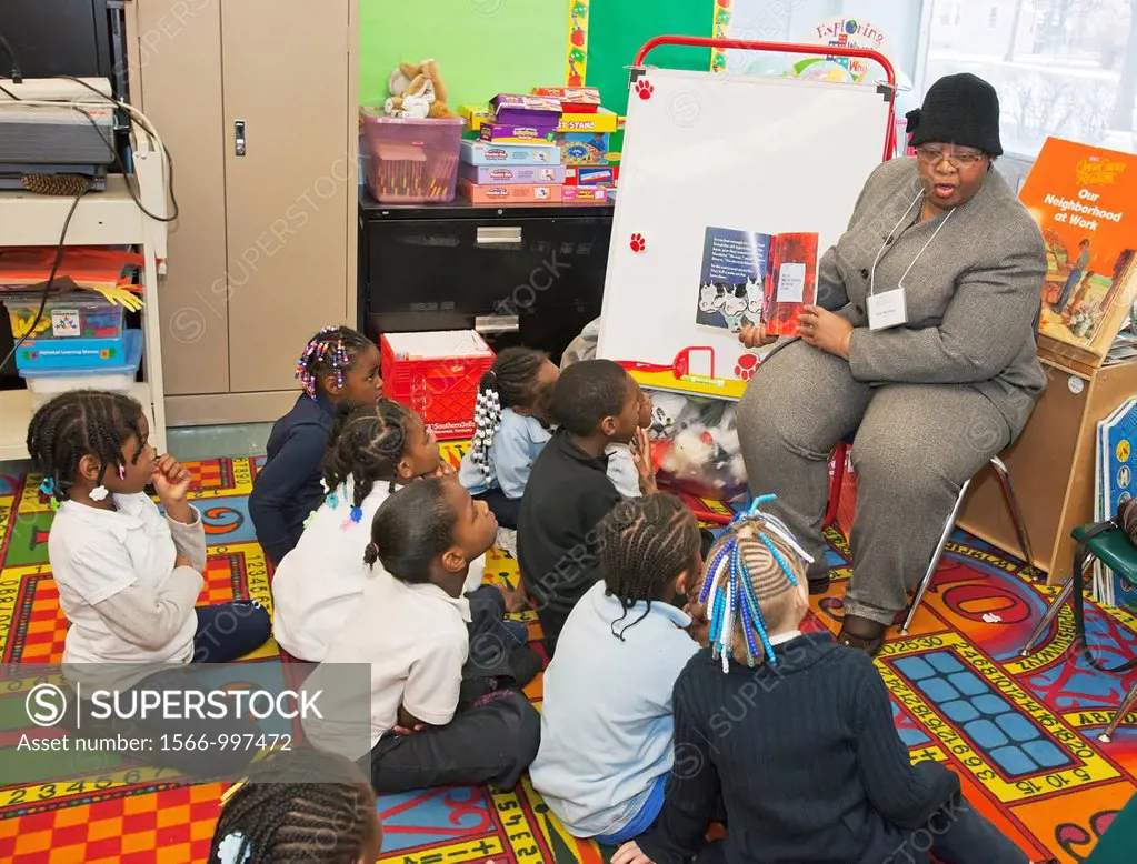 Detroit, Michigan - Ruby Newbold of the American Federation of Teachers reads to a first grade class at Sampson-Webber Elementary and Middle School  S...