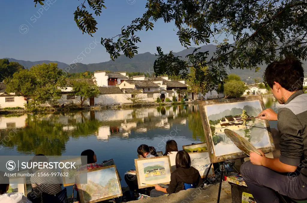 Group of student artists painting South Lake in Hongcun World Heritage Site Anhui Province China