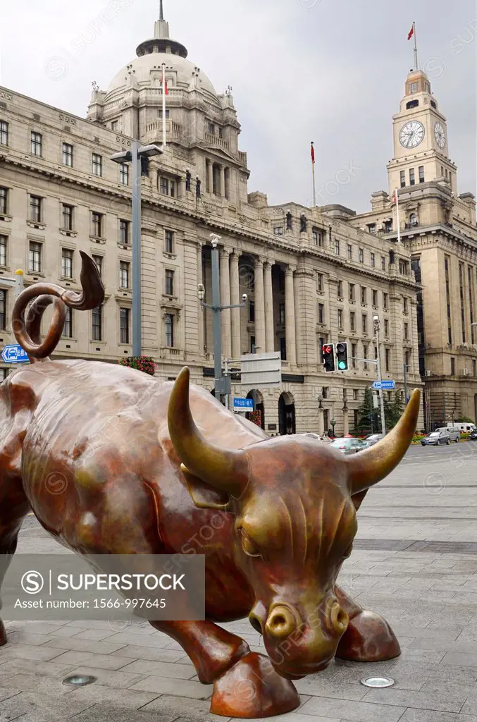 The Bund Financial Bull in Shanghai with Pudong Bank and Customs House clock tower China