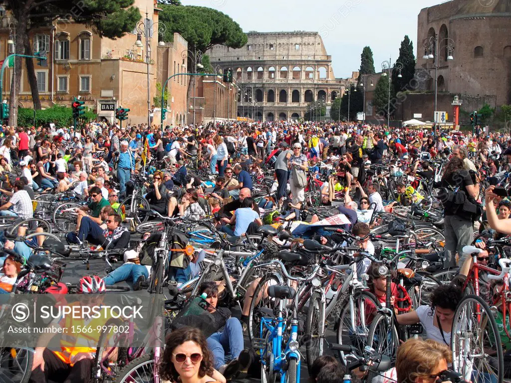 Salvaiciclisti bike protest for improved safety for riders on Via dei Fori Imperiali Street by Colosseum in Rome, Italy
