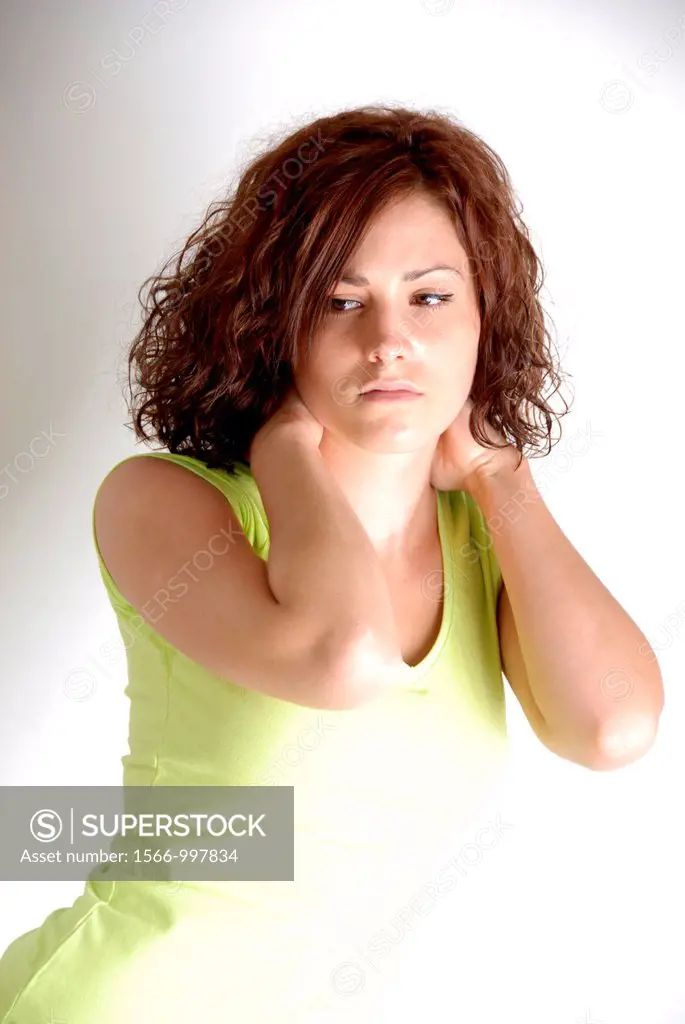 Young woman holding her painful or stiff neck