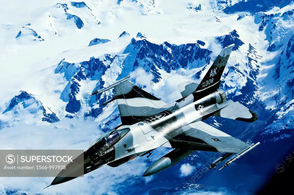 An F-15C Falcon from the 18th Aggressor Squadron, Eielson Air Force Base, Alaska, flies over a mountain range in Alaska during an excercise evolution ...